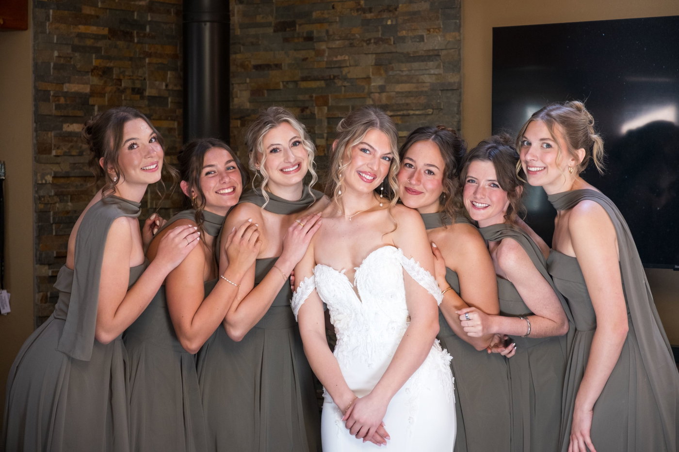 The bridesmaids gathered close