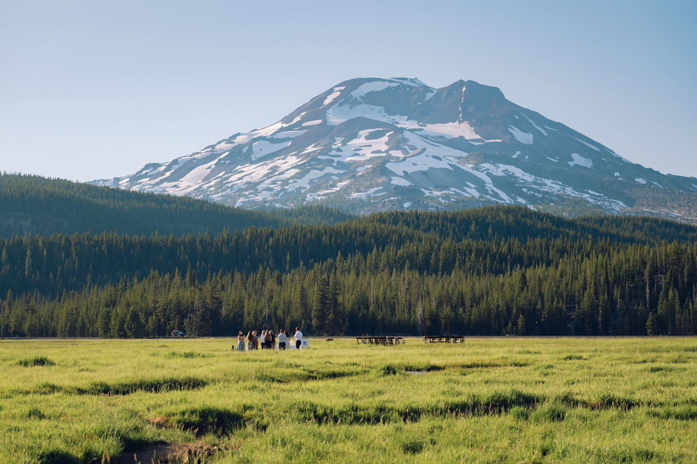 The whole party gathered small against the Cascades