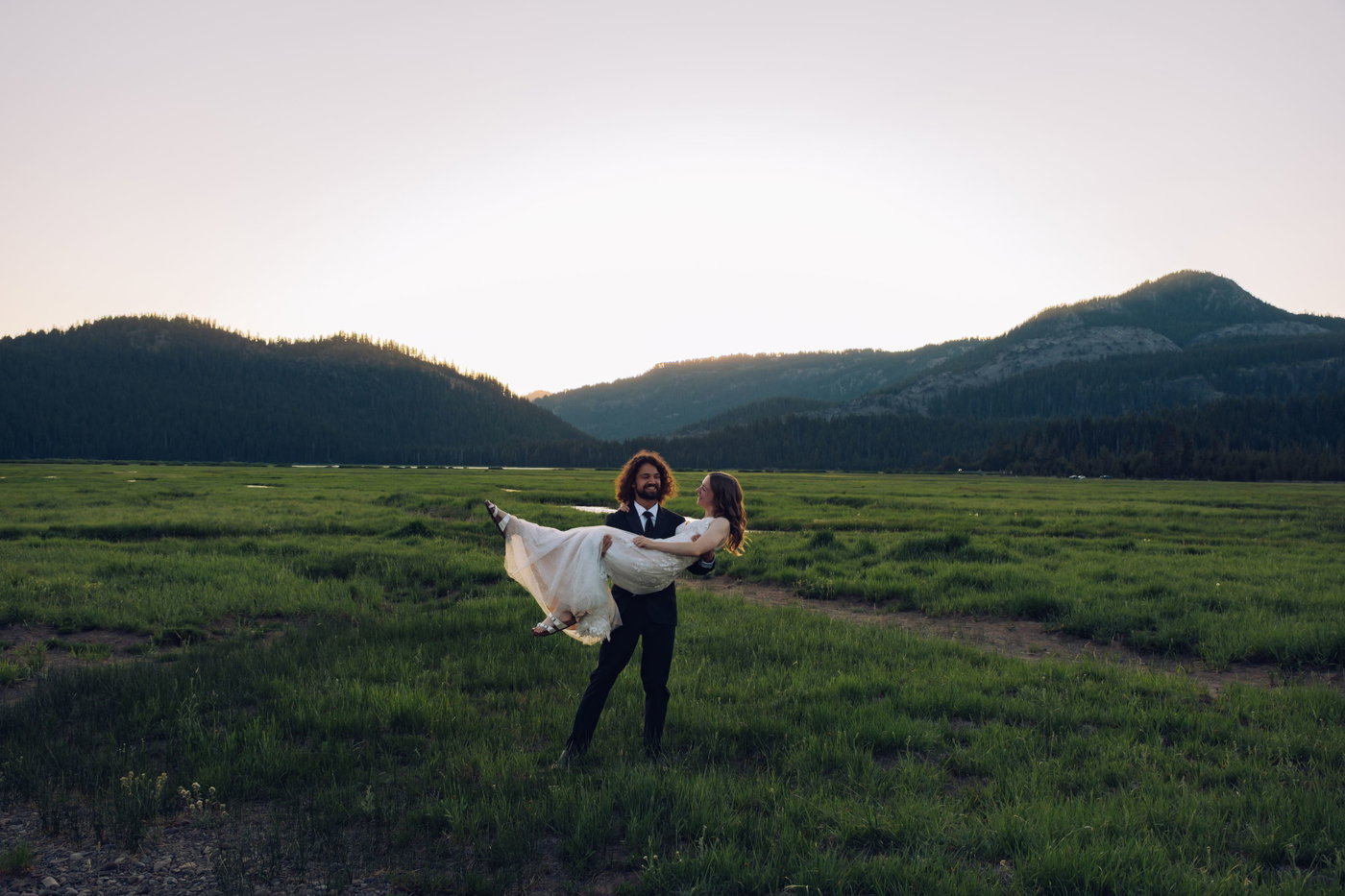 Carried through the meadow grass at golden hour